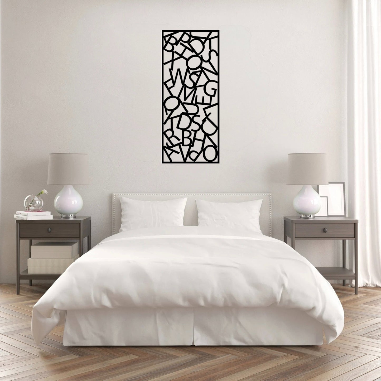 The Alphador Metal Wall Art is hung on the wall of a white bedroom, creating a sleek and contemporary focal point.