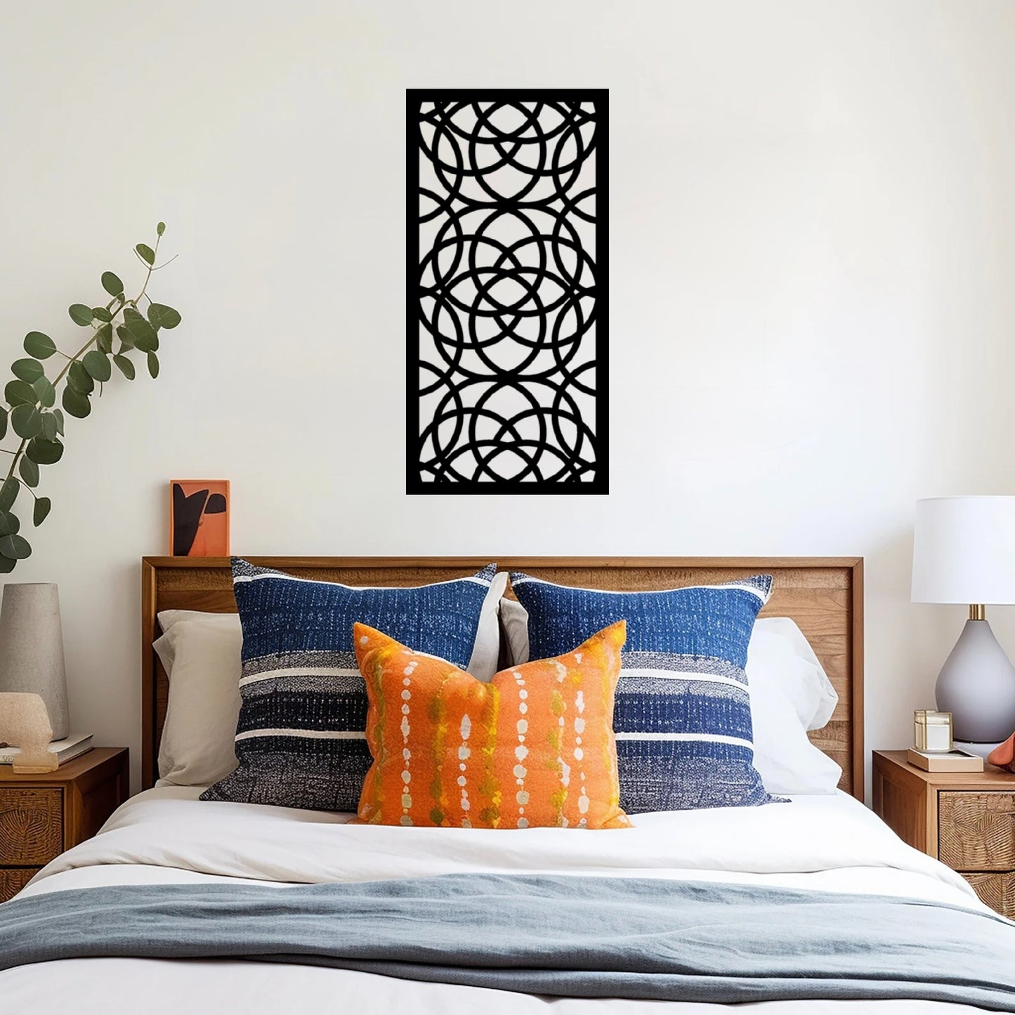 The Ellara Metal Wall Art is mounted on a bedroom wall, creating a bold, artistic focal point above the bed or along a feature wall.