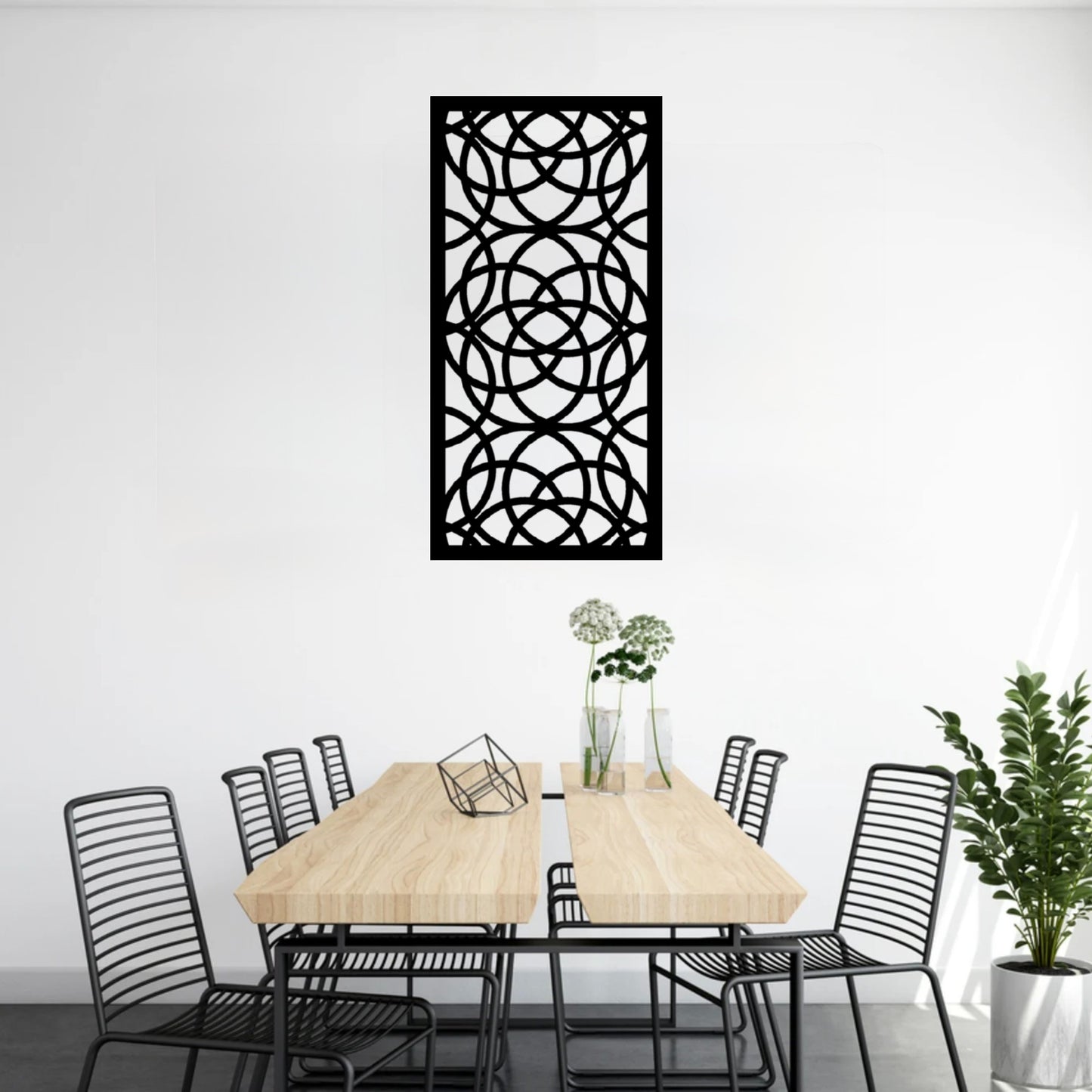 The Ellara Metal Wall Art is hung on a wall above a table, creating a stylish, balanced composition that blends form and function.