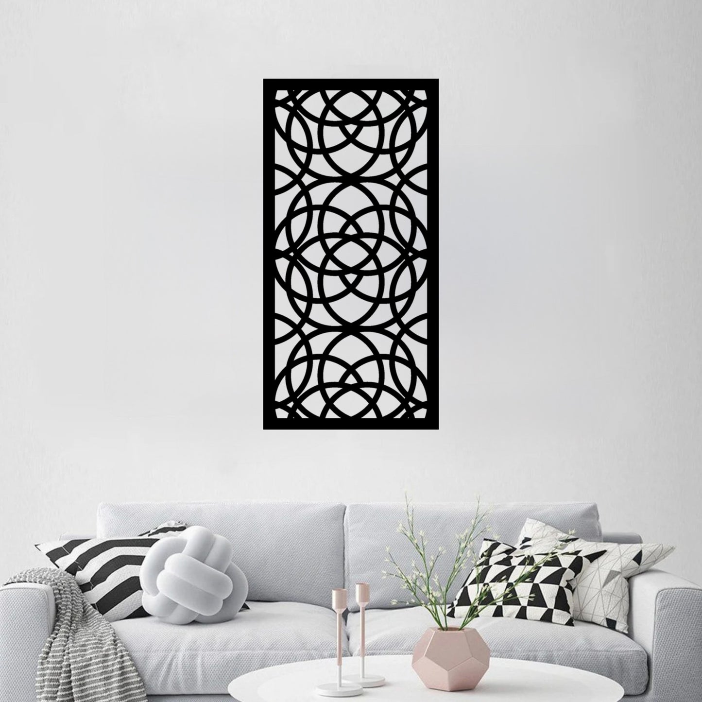 The Ellara Metal Wall Art is stylishly mounted on the wall of a living room, serving as a bold and modern focal point.