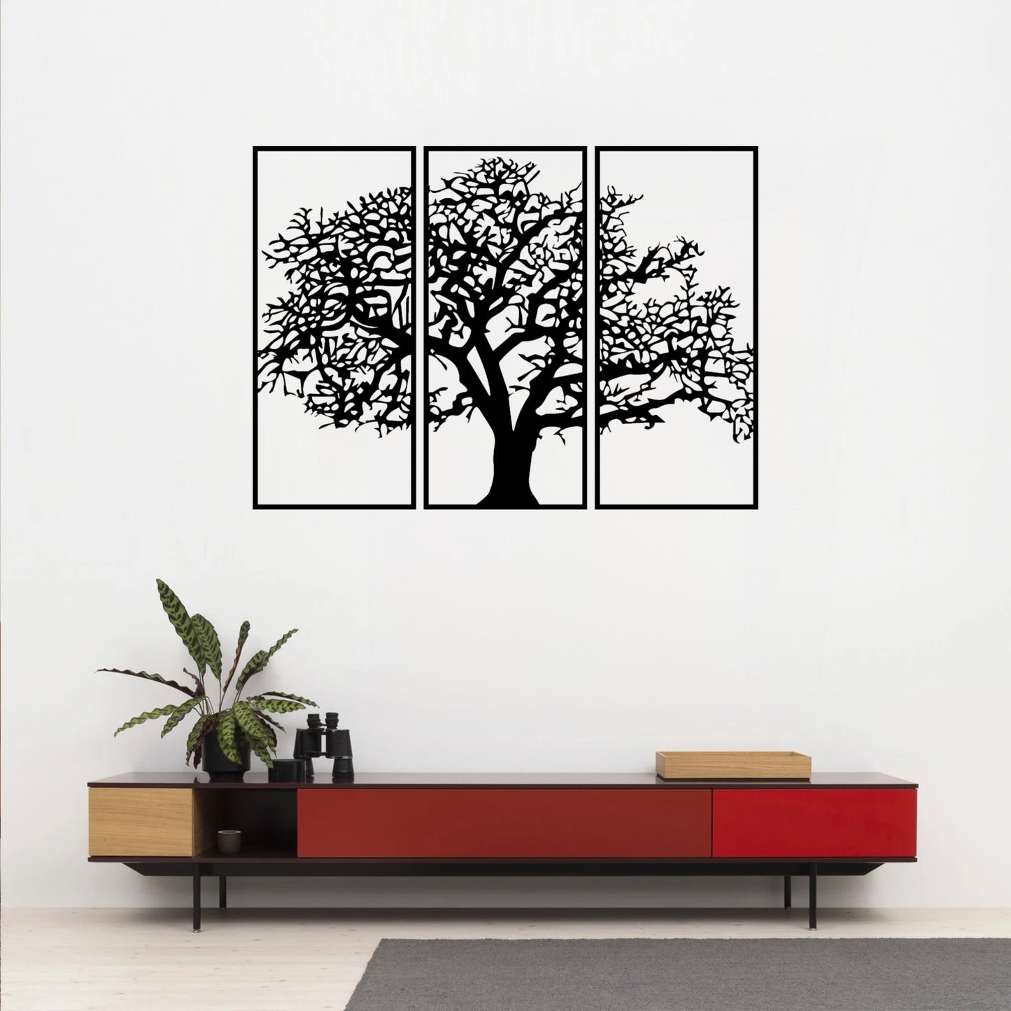 The Canopy Tree of Life Wall Art hangs on the wall just above or near a bold red desk, creating a striking and visually dynamic contrast.