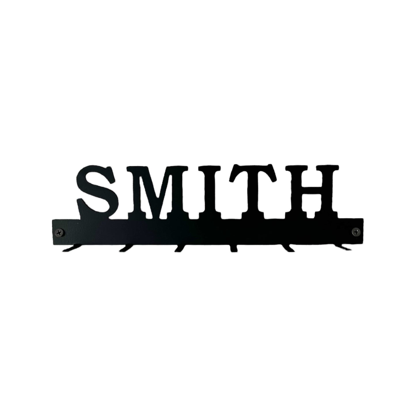 custom family name key rack with a saying stock photo