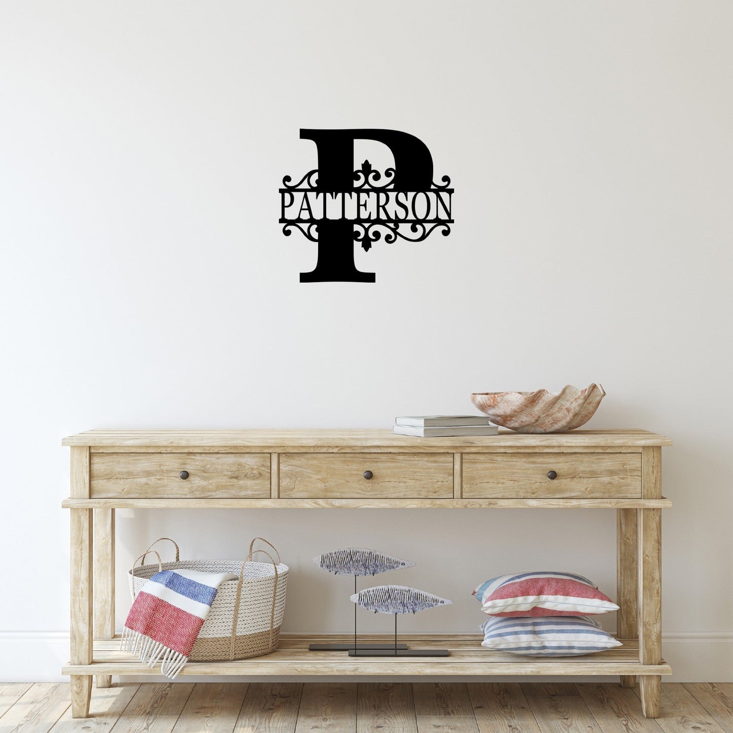 Front table with a custom split letter metal sign on the wall