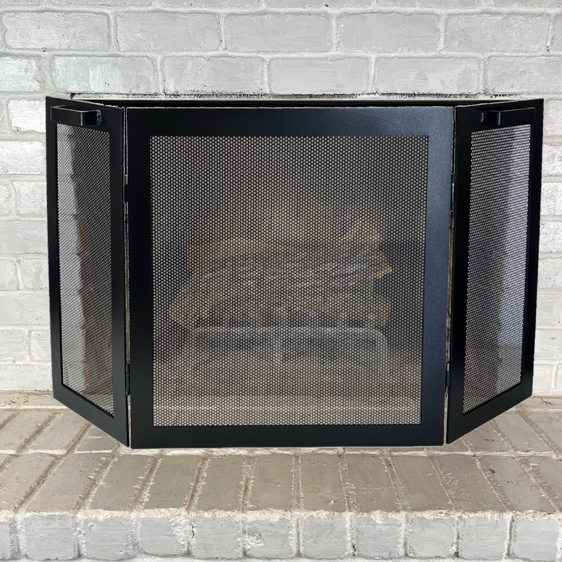 3 panel fireplace screen in front of a fireplace