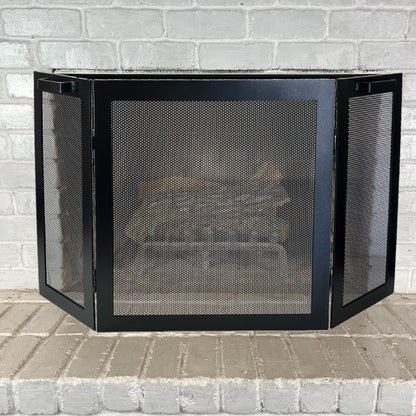 3 panel fireplace screen in front of a fireplace