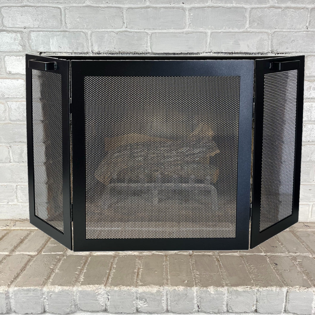 3 panel fireplace screen in front of a fireplace