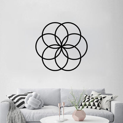 The Cerelia Metal Circles Wall Decor is elegantly displayed on a wall, creating a bold focal point in the space.