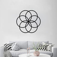 Load image into Gallery viewer, The Cerelia Metal Circles Wall Decor is elegantly displayed on a wall, creating a bold focal point in the space.