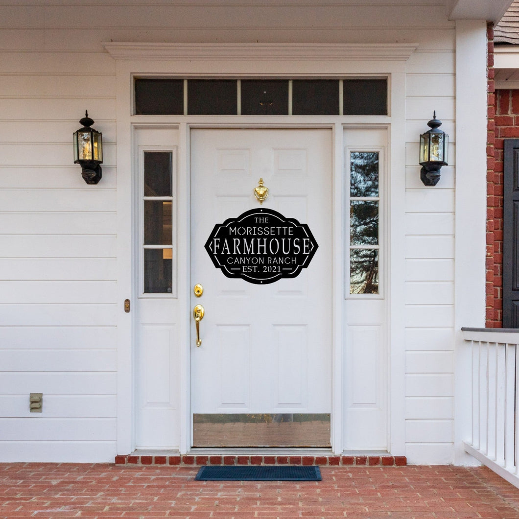 Front door of a house with a custom farmhouse sign 