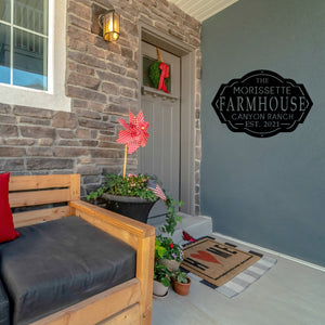 Front porch of a house with a custom farm house sign