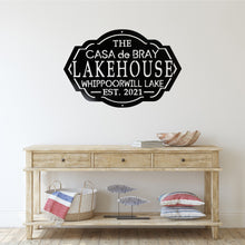 Load image into Gallery viewer, Entryway of a house with a table and a lake house sign on the wall above the table