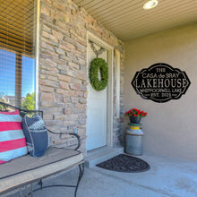 Load image into Gallery viewer, Front porch of a house with a custom lakehouse sign on the wall