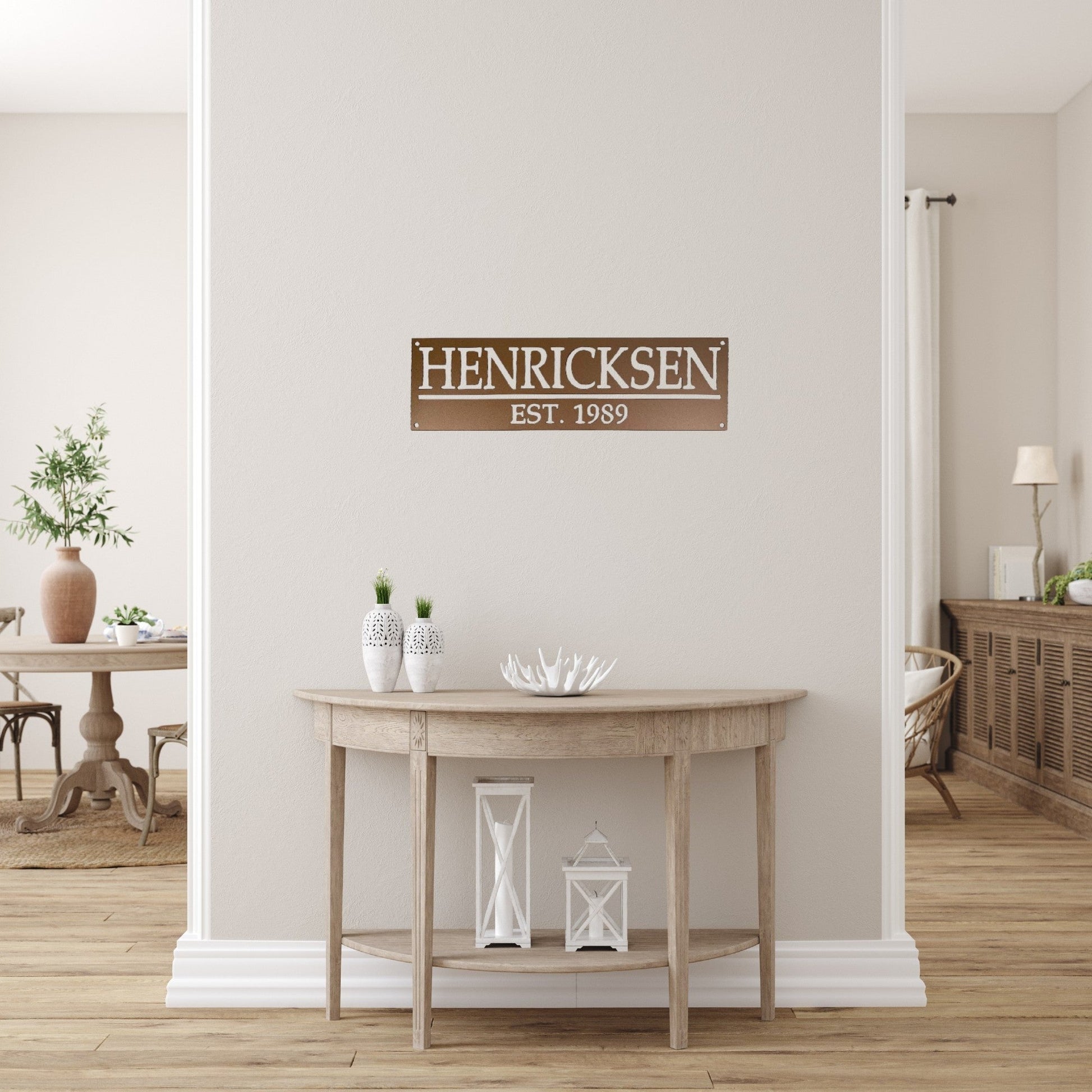 House entryway with an aged copper custom family name sign with established date