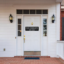 Load image into Gallery viewer, Front door of a house with a custom name sign on the door