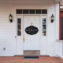Load image into Gallery viewer, Front door of a house with a black custom metal mountain house sign