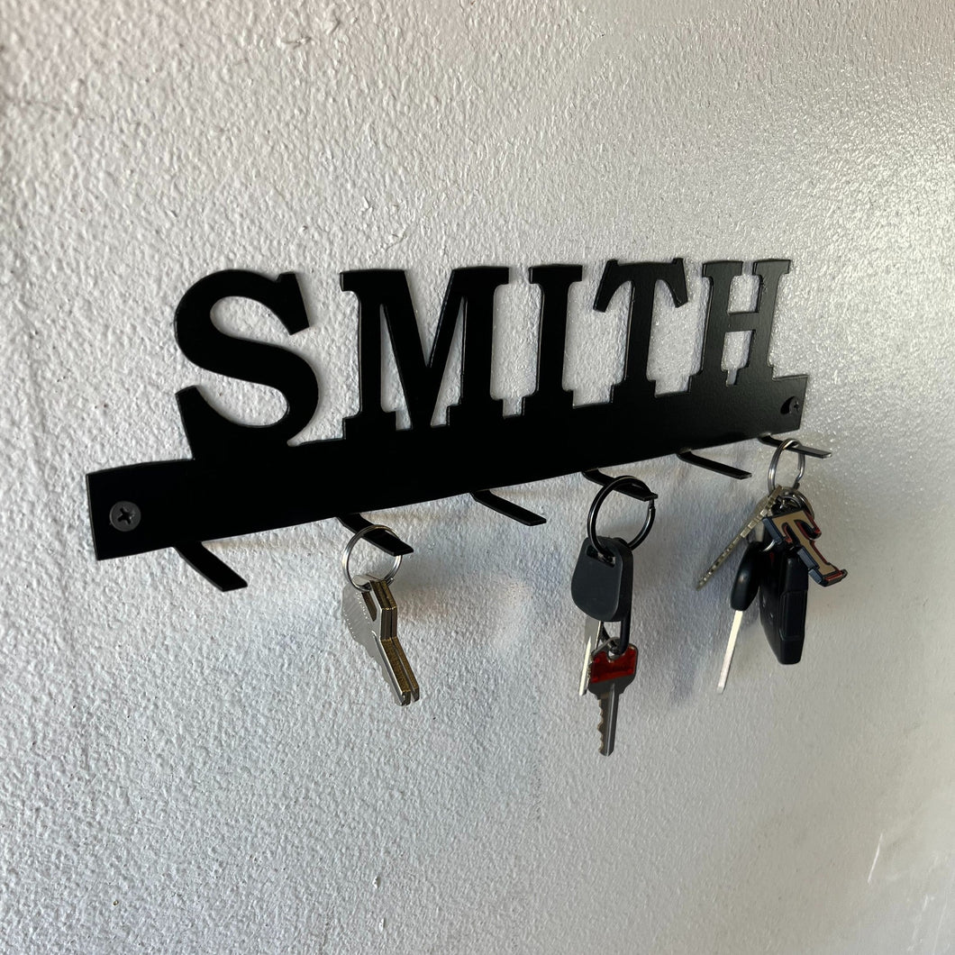 custom key rack with family name on a wall