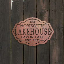 Load image into Gallery viewer, aged copper lakehouse sign on wood fence
