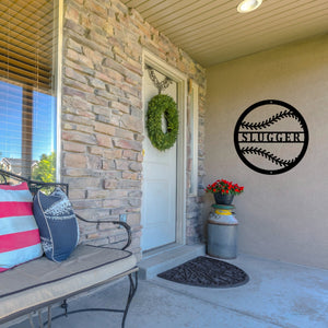 Front porch of a house with a custom metal sign like a baseball on the wall