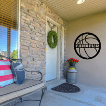 Load image into Gallery viewer, Front porch of a house with a custom metal sign in the shape of a basketball next to the door 