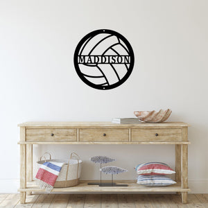 Entryway with a custom metal sign on the wall that is cut to look like a volleyball with a name in the middle 