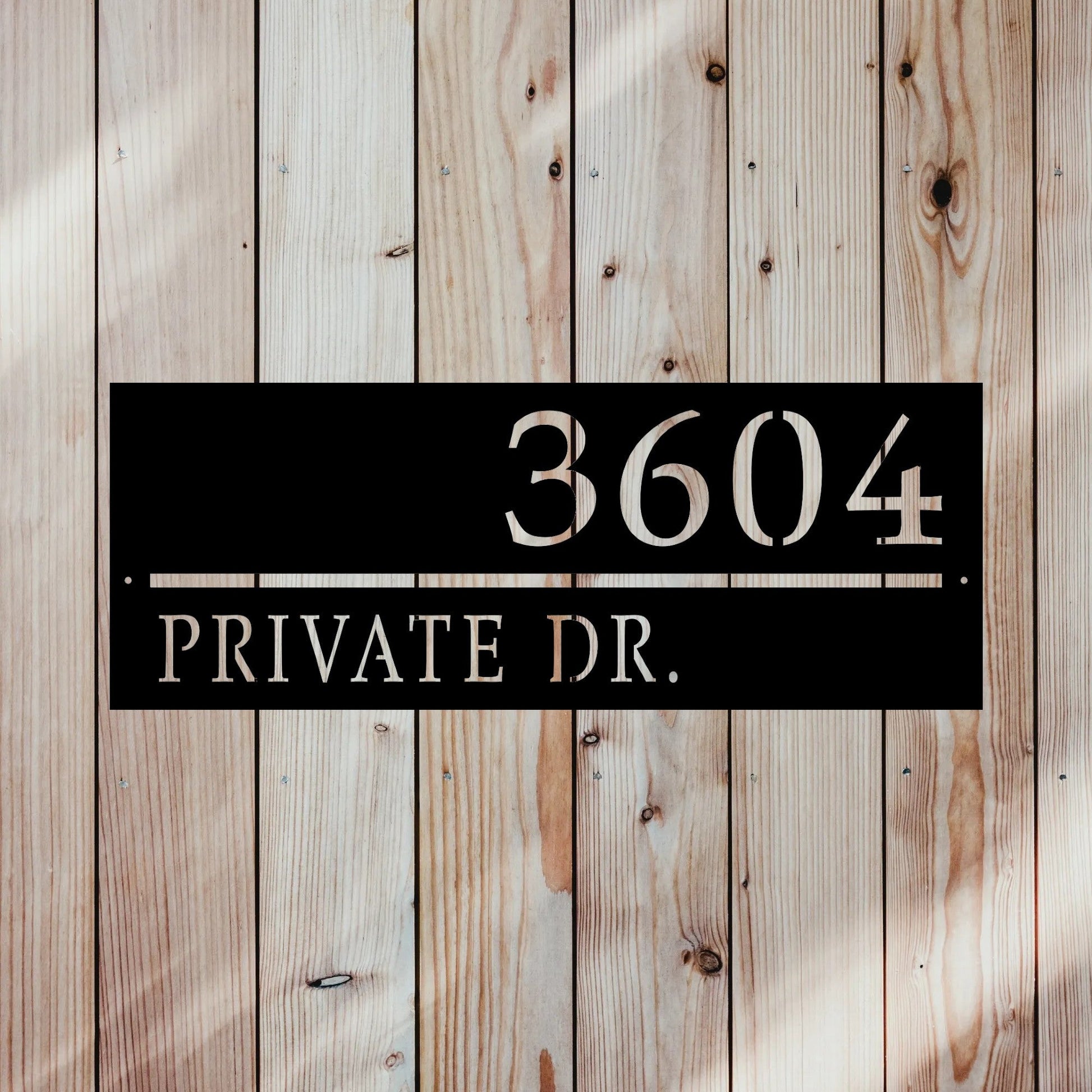 rectangular line sign with home street name and address number