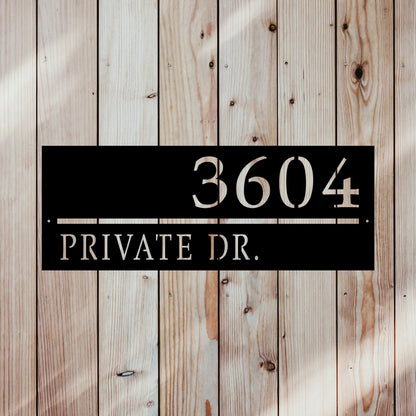 rectangular line sign with home street name and address number